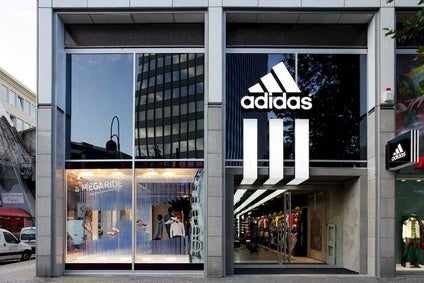GERMANY: Adidas shares fall on lower gross margin target