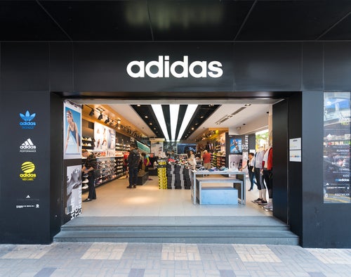 Adidas AG reports higher 4th quarter revenue, but smaller profit 